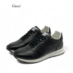 GUCCI  кроссовки черные с тиснением GG на белой подошве