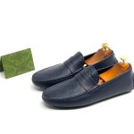 GUCCI лоферы из синей кожи в монограмму с перемычкой